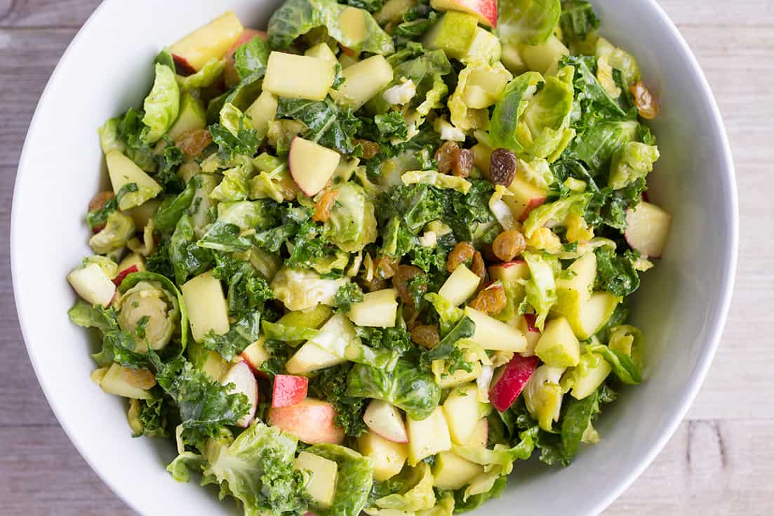 Kale and Brussels Sprout Salad with Nutritional Yeast Vinaigrette - The Foodie Eats