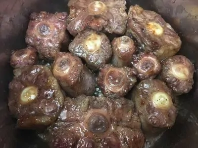 Pressure Cooker Oxtail Stew - Browning all sides in Instant Pot | The Foodie Eats