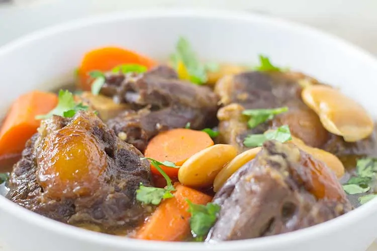 Pressure Cooker Oxtail Stew - Close-up in white bowl | The Foodie Eats