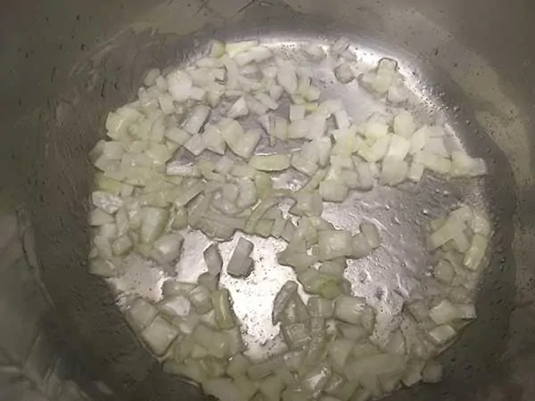 Diced onions sautéing in pot