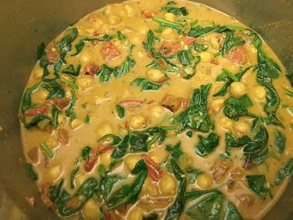 Instant Pot Curry with Chickpeas, Tomatoes and Spinach in pot.