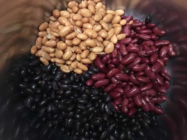 Pinto beans, black beans and kidney beans in pot.