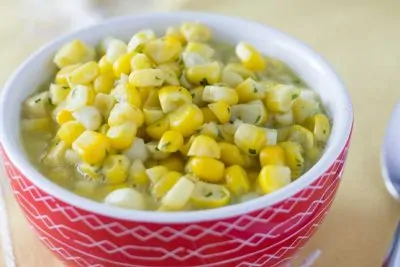 Instant Pot Creamed Corn in small red bowl.