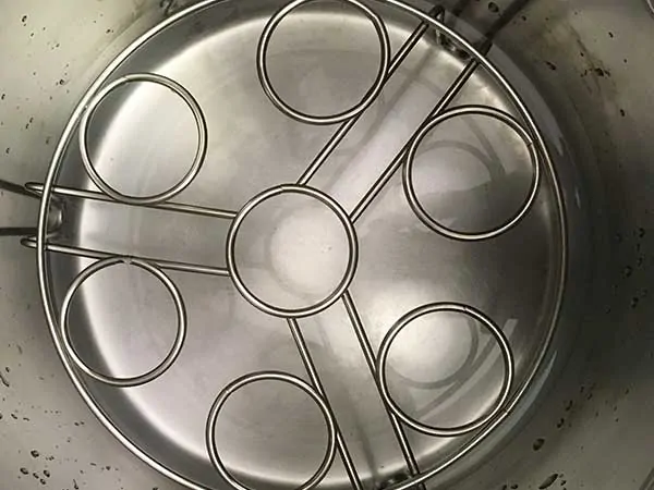 Trivet in pot with water on the bottom.