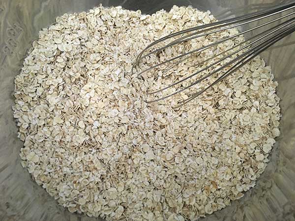 dry oat in a bowl with a whisk