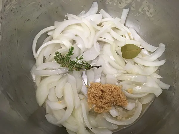 Sautéed onions with thyme, garlic, and bay leaf.
