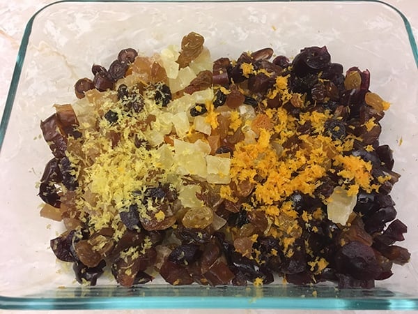 dried fruits and citrus zest in Pyrex dish