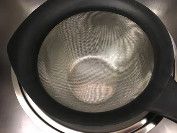 Fine mesh strainer in mixing bowl