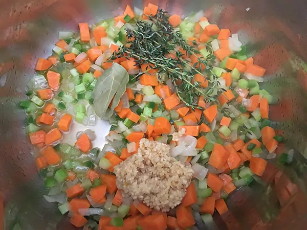 onions, carrots, celery, thyme, bay leaves, garlic, and apple cider vinegar