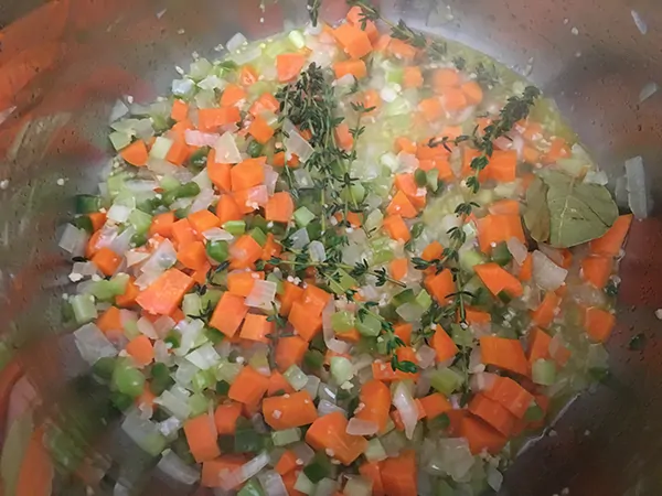 onions, carrots, celery, thyme, bay leaves, and apple cider vinegar