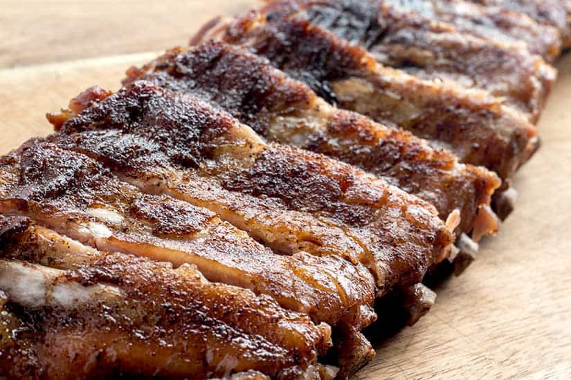 dry-rubbed ribs on wood cutting board