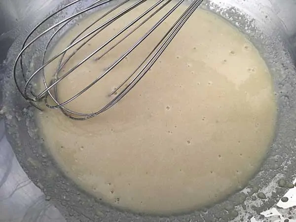 almond flour and chicken broth in mixing bowl