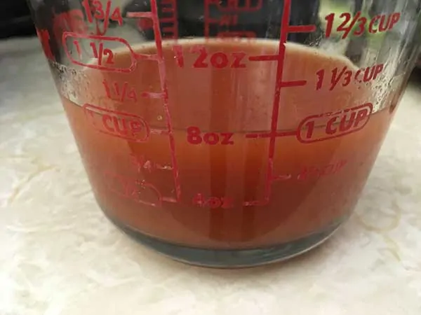 wing sauce in measuring cup
