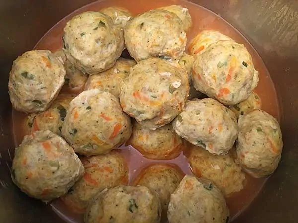chicken and sausage meatballs in Instant Pot with broth and wing sauce