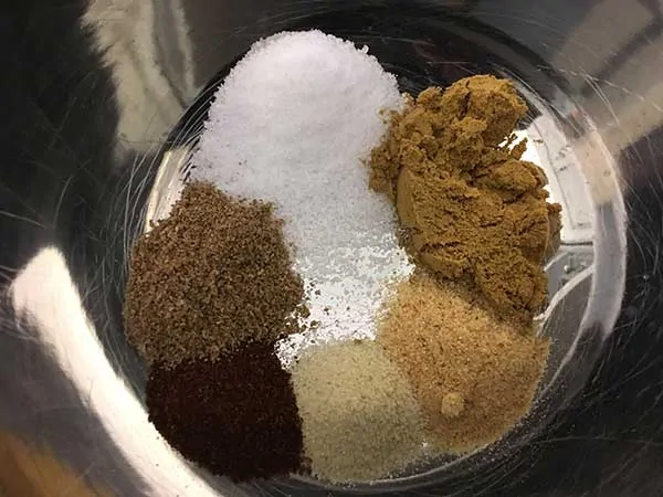 separated spices in metal bowl