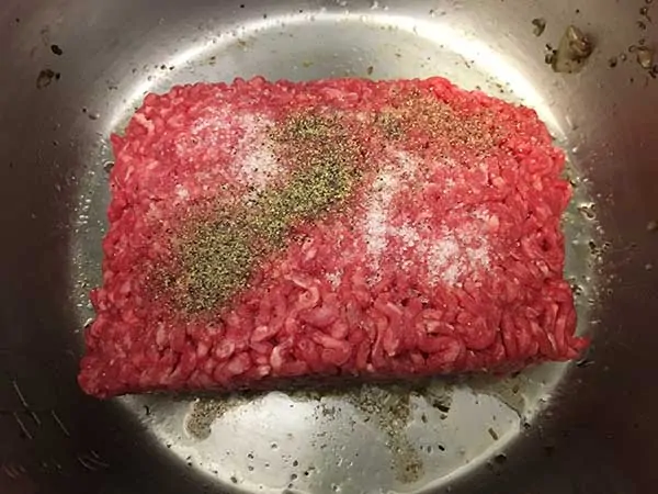 raw ground beef topped with salt and pepper