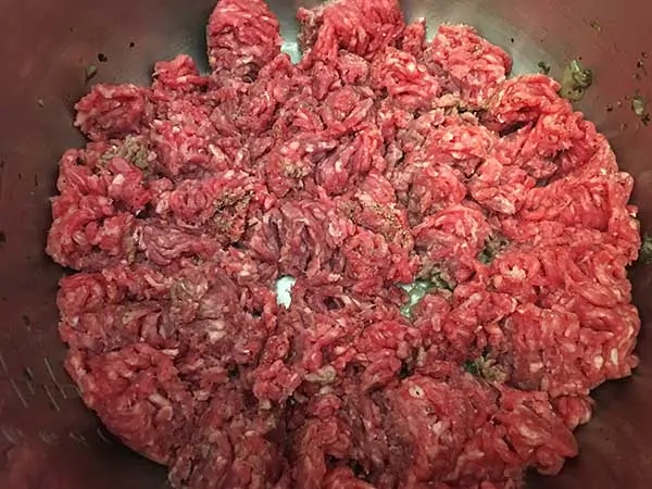 raw ground beef, broken up and topped with salt and pepper