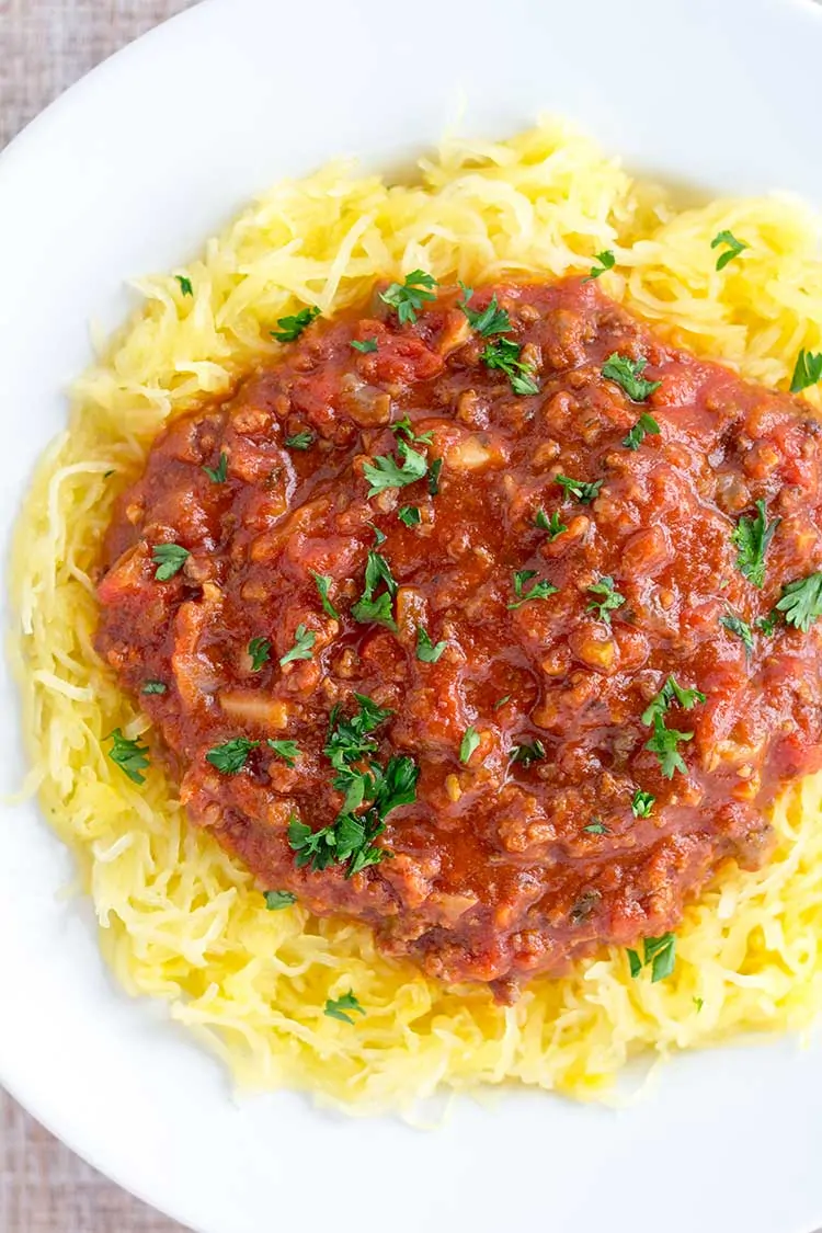 spaghetti squash and sauce on white bowl