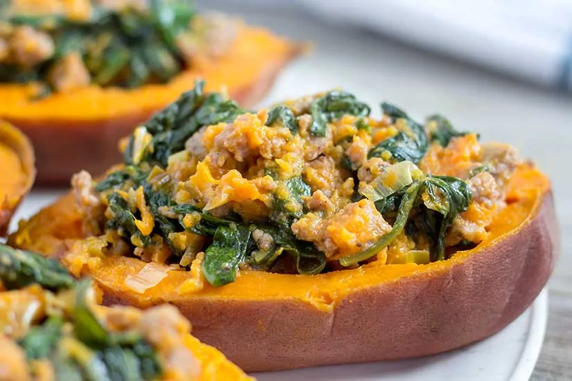 stuffed sweet potatoes on white plate