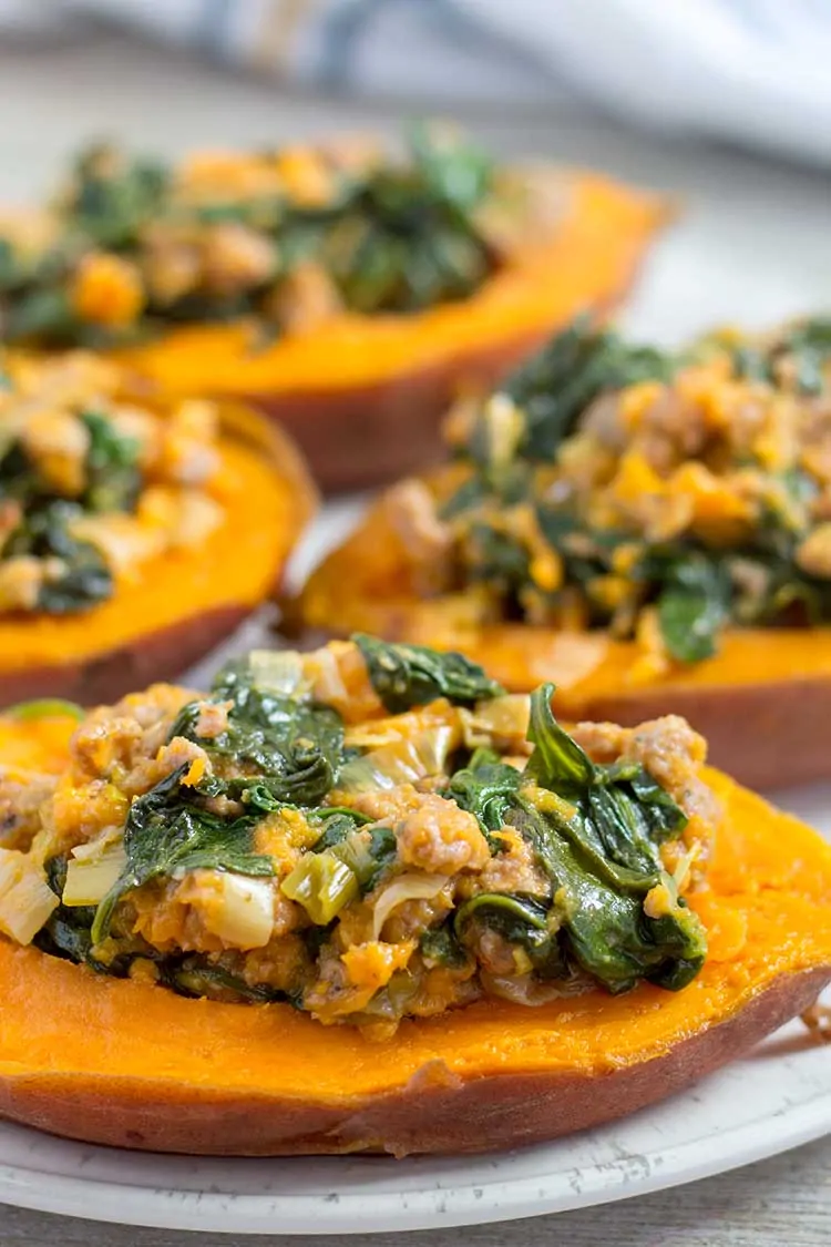 stuffed sweet potatoes on white plate