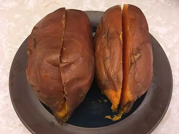 two sweet potatoes cut in half