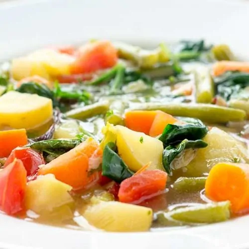 Vegetable soup in white bowl