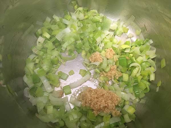 leeks and minced garlic sautéing in Instant Pot