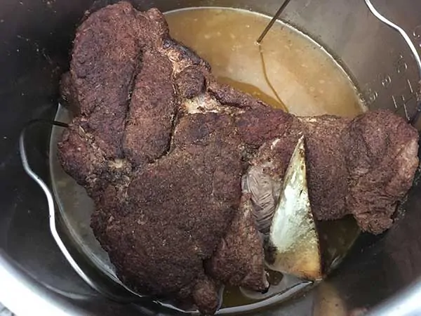 Fully cooked pork roast inside Instant Pot.