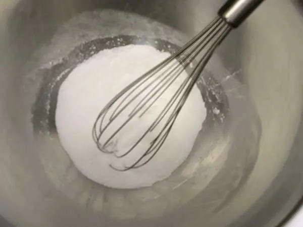 sugar and cornstarch in mixing bowl with whisk.