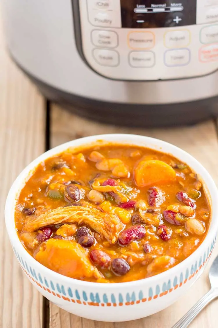 Instant Pot Sweet Potato Chicken Chili in bowl with Instant Pot in background
