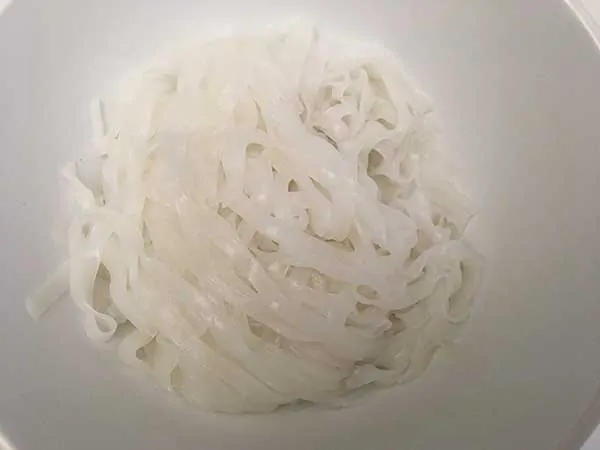 rice noodles in white bowl.