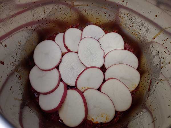 Layer of red potatoes.