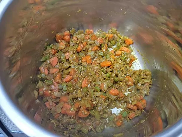 Mirepoix sautéing with curry spices.