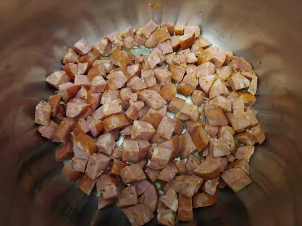 Chopped andouille sausage in Instant Pot.