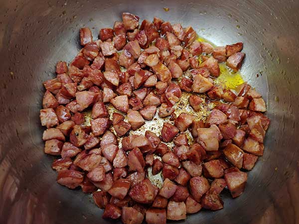 Browned andouille sausage in Instant Pot.