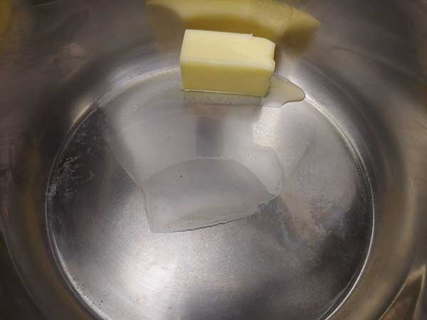 Butter melting in pot.