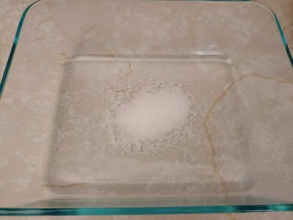 Sea salt in Pyrex dish.