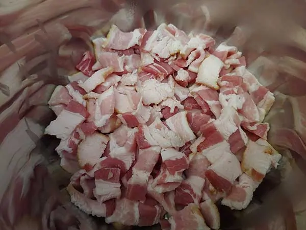 Diced uncooked bacon in Instant Pot.