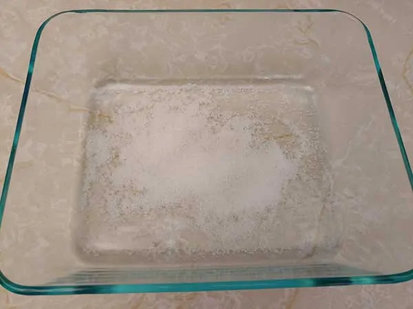 Sea salt in empty Pyrex dish.
