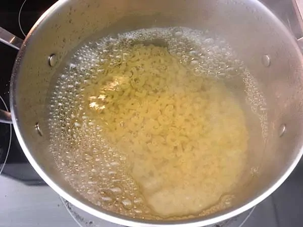 Elbow pasta in boiling water.