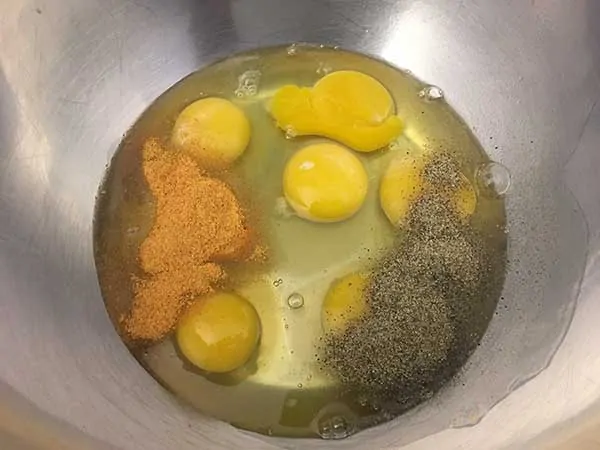 Six eggs seasoned with seasoned salt and pepper.