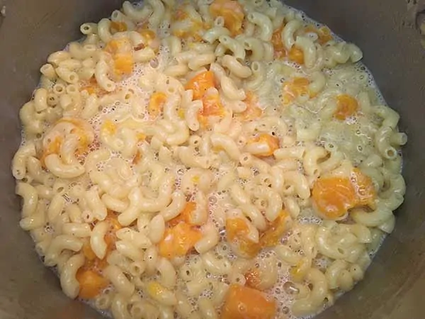 Eggs/milk mixture combined with pasta/cheese mixture.