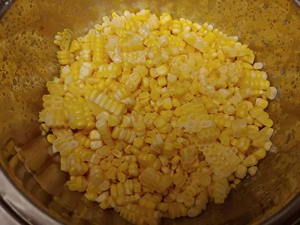Corn kernels in large mixing bowl.