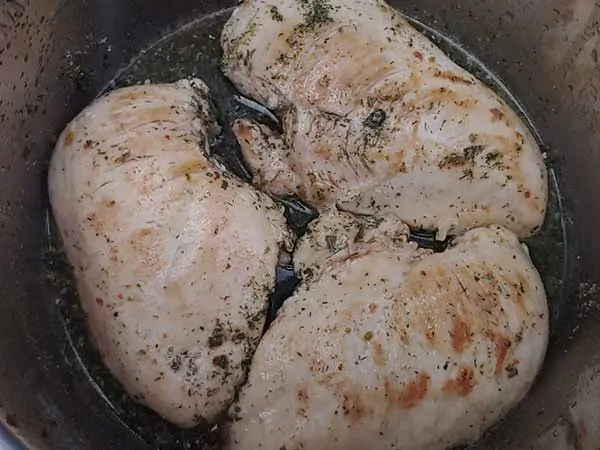 Chicken breasts in ranch-flavored broth.