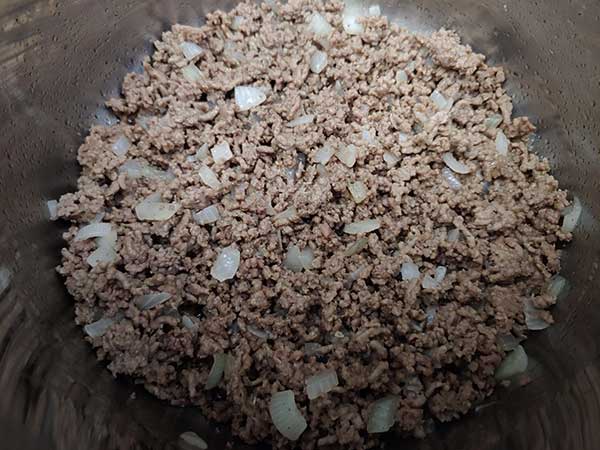 Cooked ground beef and onions.