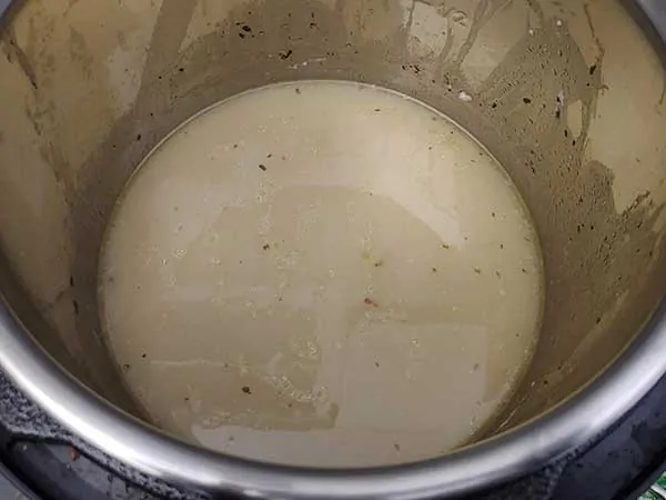 Ranch-flavored chicken broth in pot.