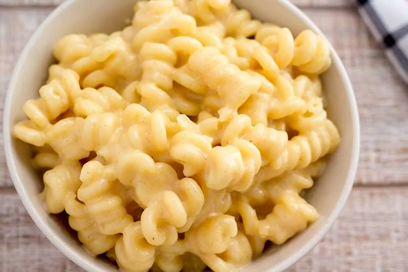 Truffled mac and cheese in white bowl.