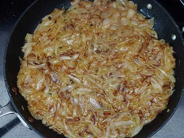 Caramelized onions in nonstick pan.