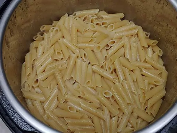 Cooked penne pasta in Instant Pot.