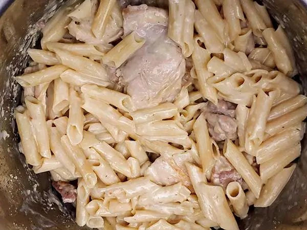 Chicken and penne pasta in creamy sauce.